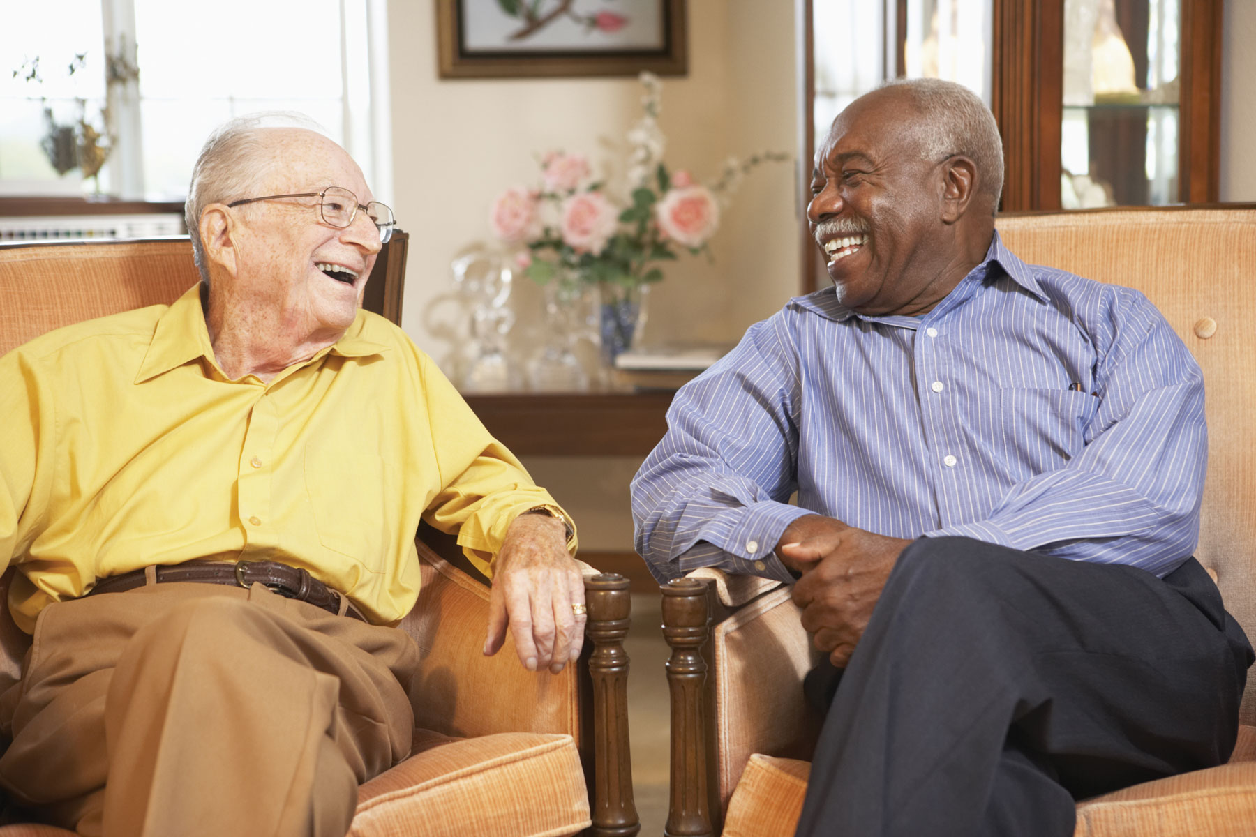 Two men laughing together