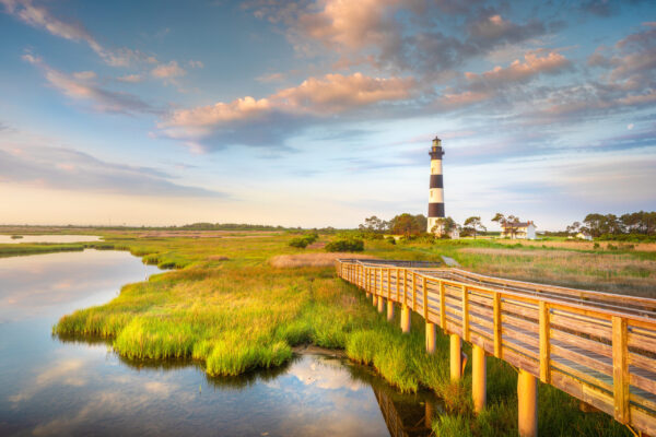 Part of the beautiful Cape Hatteras National Seashore, the Bodie Island Lighthouse is an Iconic Lighthouse of Nags Head Outer Banks North Carolina. This incredible stretch of coastal barrier islands along the east coast of NC is known for its amazing beaches and abundant wildlife.